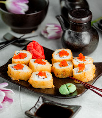 sushi with sauce and red caviar