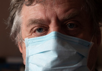 Retired man with protective mask.