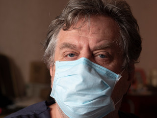 Retired man with protective mask.