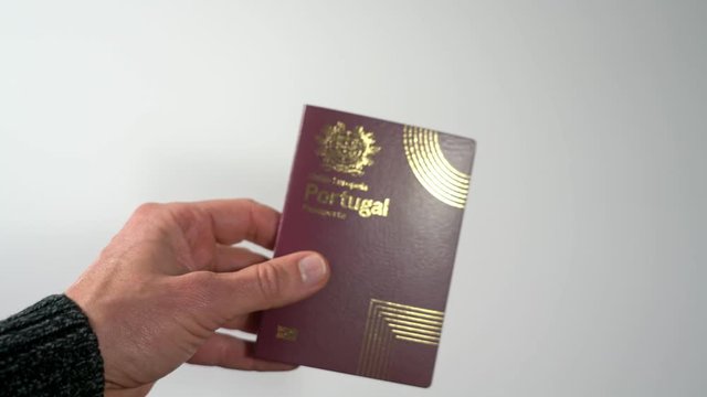 Foreign European passport Schengen, Portugal closeup on a white background.