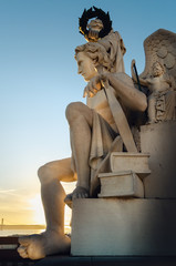 Detail of the Arco da Rua Augusta, triumphal arch in Praca do Comercio, main square of lisbon, Portugal. The statue is an allegory of Genius crowned with laurel leaves