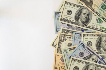 Side frame of different dollar cuperas randomly lie on a white background. Concept business,...