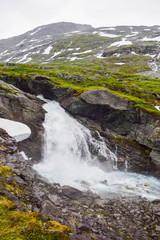 Waterfall and river with clear water. Jostedalsbreen National Park. Norway.