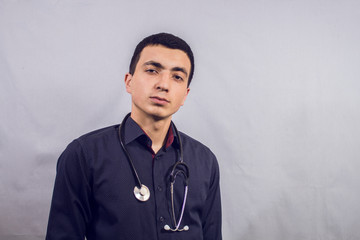 doctor stands with a stethoscope