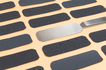 Set of cosmetic sandpaper on a beige background