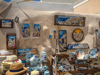 Santorini, Greece - September 10: Souvenir shop under the open sky, many beautiful paintings, pottery, Santorini, Greece.