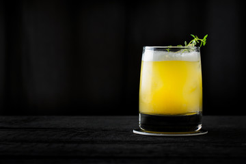 vintage style orange cocktail on black background