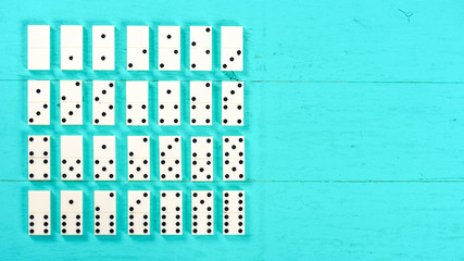 Dominoes on a blue wooden table