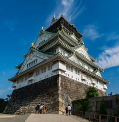 Osaka castle building and tourists.