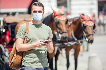 Young man background the old european city take selfie
