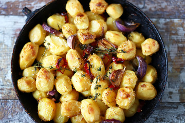 Baked potatoes in a pan. Cooking at home. Appetizing potatoes.
