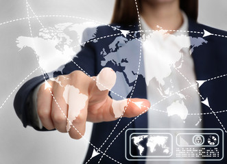 Travel agency services. Woman touching world map on virtual screen