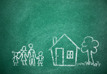 House and family drawn with chalk on school board