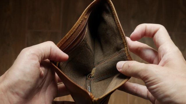 Man bankrupt arrears showing empty wallet with no money. Poverty finance business bankruptcy concept. Male debt businessman showing empty wallet. Financial crisis of getting into debt. no money on