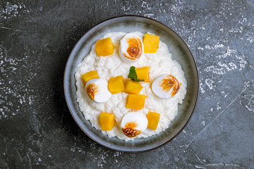 rice porridge with mango and marshmallows