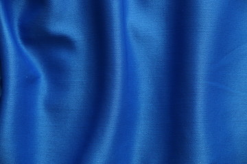 fondo azul textil con reflejos de luz blanca
