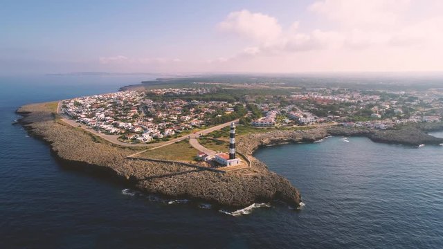 Picturesque coastline with lighthouse and town