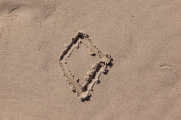 diamond drawn in beach sand