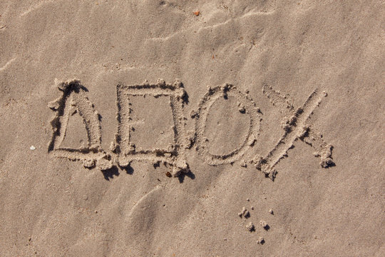 Playstation Symbols Written In Beach Sand