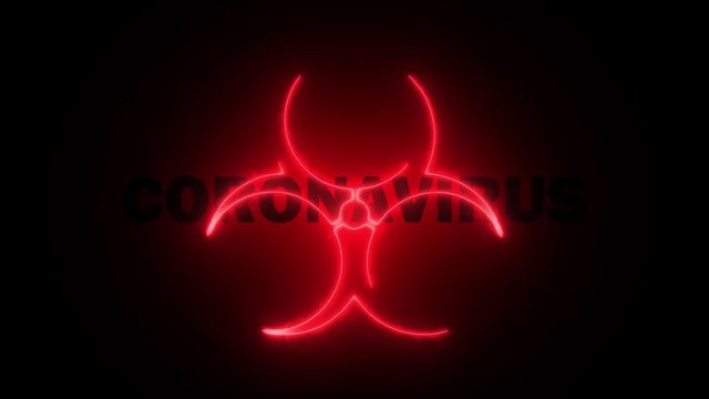 A biohazard sign appears spectacularly against the background of the word Coronavirus in a bright red flame