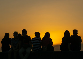 silhouette of people on the beach