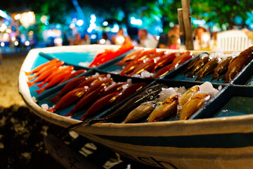 Showcase with fresh fish in a restaurant on the Indian Ocean