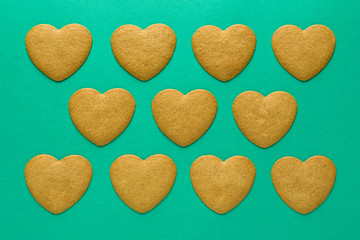 heart-shaped gingerbread on a green background