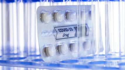 A pack of the coronavirus drug pills in the test tubes