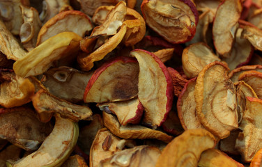 Many dried little ranetki apples with seeds red yellow