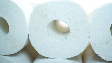 Rolls of the bathroom tissue paper in the table