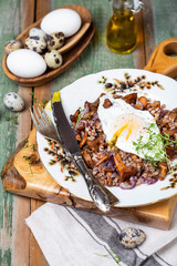 Buckwheat porridge with wild mushrooms chanterelles and egg