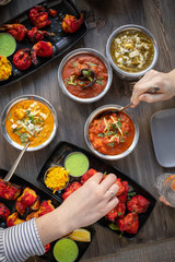 people eating in an Indian restaurant, view from above over the table