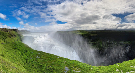 Panoramic view of Gullfoss waterfall on the Hvítá river, a popular tourist attraction and part of the Golden Circle Tourist Route in Southwest Iceland. Golden Waterfall.