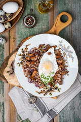 Buckwheat porridge with wild mushrooms chanterelles and egg