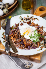 Buckwheat porridge with wild mushrooms chanterelles and egg