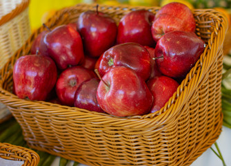 Basket of fruits. Fresh apples on the table. 