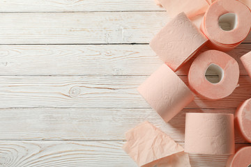Toilet paper on wooden background, space for text