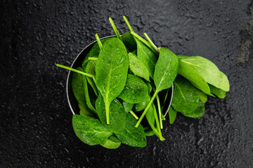 Spinach on a vintage background (close-up; selective focus)
