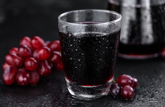 Red Grape Juice (selective focus; detailed close-up shot)