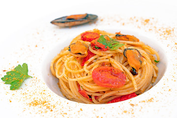 spaghetti with mussels bottarga fish and cherry tomatoes