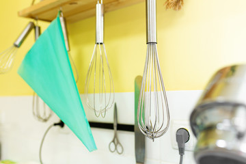 Set of whisks for whipping cream, kitchen tools. Sweet pastries, recipes, cooking