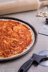 Tomato top topping pizza during baking.