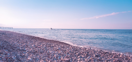 A rocky beach on the Black Sea in Batumi, Georgia. Quiet and empty background.