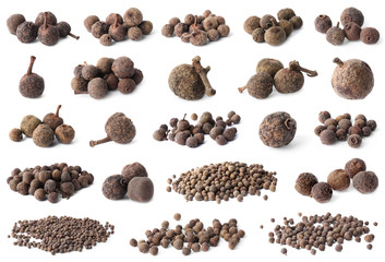 Set of different peppercorns on white background