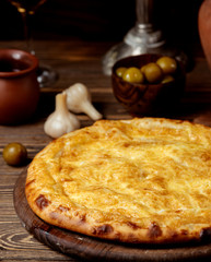 traditional cheese khachapuri on the table