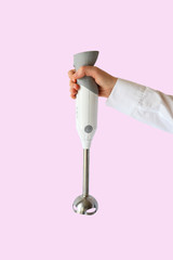 Isolated handblender in woman hand. Element of design.