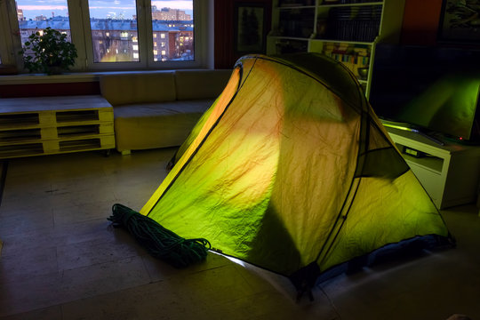 Indoor Life At The Coronavirus Quarantine. Indoor Hiking Trip. Shining Tent At Apartment.