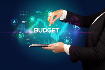 Close-up of a touchscreen with BUDGET inscription, business opportunity concept