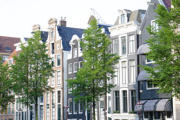Fototapeta premium Traditional old buildings in Amsterdam, the Netherlands