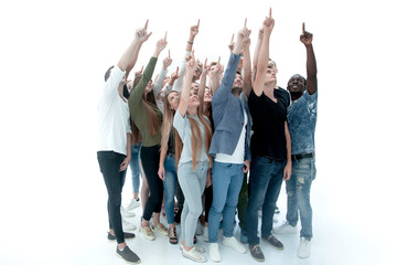group of diverse young people pointing upwards